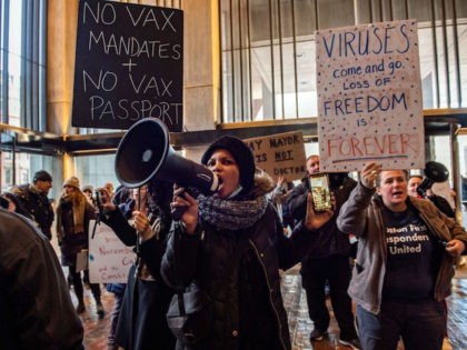 Demonstrators, including many first responders, protest the new vaccine mandate at City Hall in Boston, Massachusetts, on December 20, 2021. - Boston Mayor Michelle Wu announced that starting January 15, 2022, guest and employees, in the Boston will be required to show proof of vaccination against Covid-19 in order to …