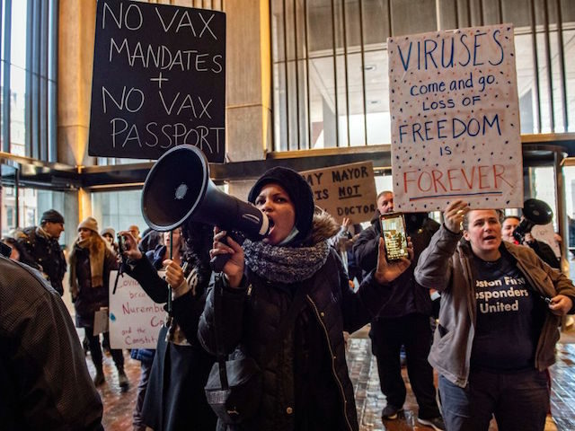 Demonstrators, including many first responders, protest the new vaccine mandate at City Ha