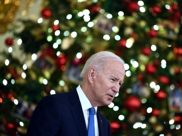 US President Joe Biden speaks about the status of the countrys fight against Covid-19 and the Omicron variant, in the State Dining Room of the White House in Washington, DC, on December 21, 2021. (Photo by Brendan Smialowski / AFP) (Photo by BRENDAN SMIALOWSKI/AFP via Getty Images)