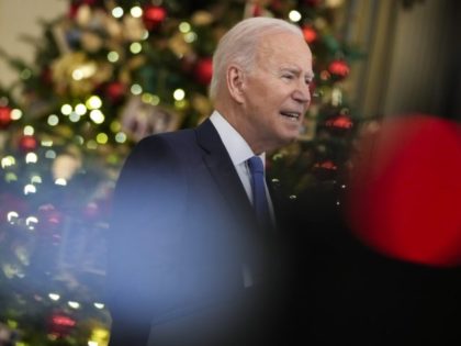 WASHINGTON, DC - DECEMBER 21: U.S. President Joe Biden speaks about the omicron variant of the coronavirus in the State Dining Room of the White House, December 21, 2021 in Washington, DC. As the omicron variant fuels a new wave of COVID-19 infections, Biden announced plans that will expand testing …