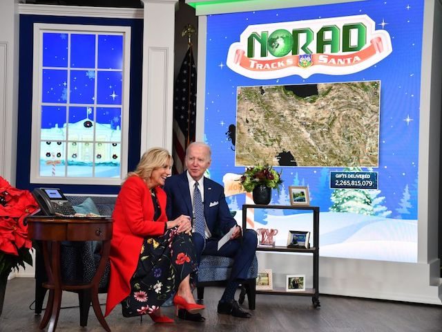 US President Joe Biden and First Lady Jill Biden speak with NORAD (North American Aerospace Defense Command) from the South Auditorium of the White House in Washington, DC, as NORAD tracks Santa Claus' travel over the globe delivering gifts. (Photo by Nicholas Kamm / AFP) (Photo by NICHOLAS KAMM/AFP via …