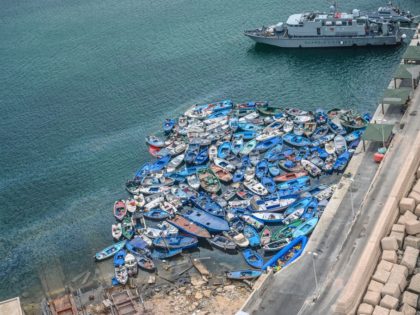 LAMPEDUSA, ITALY - AUGUST 04: Aerial view of boats and inflatables used by migrants disembarked in recent days in Lampedusa and abandoned in the port of the island waiting to be demolished on August 04, 2020 in Lampedusa, Italy. The Italian island has reportedly run out of room to quarantine …