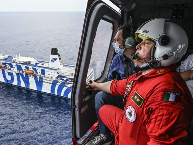 LAMPEDUSA, ITALY - AUGUST 04: The Councillor for Health of the Sicilian Region, Ruggero Razza, watches from the fire brigade helicopter the quarantine ship "Gnv Azzurra", moored in front of the island of Lampedusa, which will host almost all the migrants guests of the island's hotspot on August 04, 2020 …