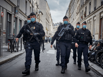 PARIS, FRANCE - SEPTEMBER 25: Armed police secure the area of around the former Charlie Hebdo headquarters, and scene of a previous terrorist attack in 2015, after two people were stabbed on September 25, 2020 in Paris, France. French National Anti-terrorist Prosecutor's office have opened an investigation into the attempted …