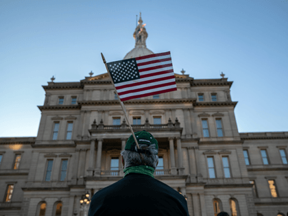Protesters attend a "Count On Us" rally at the Michigan State Capitol building on November 04, 2020 in Lansing, Michigan. People gathered to demand that all votes be counted in the 2020 election before any candidate declares victory. (Photo by John Moore/Getty Images)
