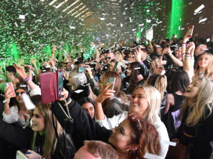 LIVERPOOL, ENGLAND - APRIL 30: Confetti is fired into the crowd as Nightclub Circus hosts the first dance event, which will welcome 6,000 clubbers to the city's Bramley-Moore Dock warehouse on April 30, 2021 in Liverpool, England. The event is part of the national Events Research Programme which will provide …