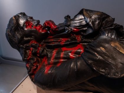 BRISTOL, ENGLAND - JUNE 07: The toppled statue of Edward Colston lies on display in M Shed museum on June 7, 2021 in Bristol, England. The controversial bronze statue of 17th Century slave merchant Edward Colston was graffitied and pulled down during a Black Lives Matter protest one year ago. …