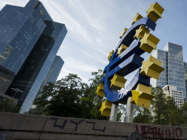 FRANKFURT AM MAIN, GERMANY - JUNE 09: A woman sits by the Euro sculpture in the financial district on June 09, 2021 in Frankfurt, Germany. While the German economy is showing positive trends as authorities ease nationwide lockdown measures, several of Germany's biggest banks are continuing to struggle. (Photo by …