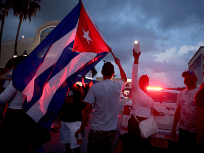People rally in front of Versailles, a Cuban restaurant in the Little Havana neighborhood, in support of the protests in Cuba on July 11, 2021 in Miami, Florida. Thousands took to the streets across Cuba to protest pandemic restrictions, the pace of Covid-19 vaccinations and the Cuban government. (Photo by …