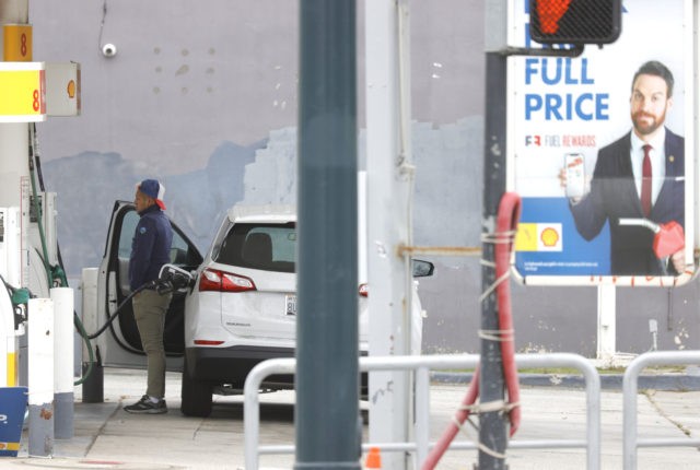 SAN FRANCISCO, CALIFORNIA - JULY 12: A customer pumps gas into his car at a Shell station