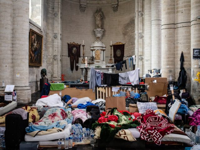 BRUSSELS, BELGIUM - JULY 14: For more than fifty days, hundreds of undocumented migrants have been on hunger strike at St John the Baptist Church at the Beguinage / House of Compassion on July 14, 2021 in Brussels, Belgium. The migrants, who said they have lived and worked in Belgium …