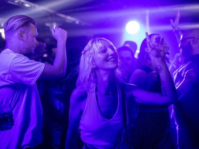 LONDON, ENGLAND - JULY 19: People dancing at Egg London nightclub in the early hours of July 19, 2021 in London, England. As of 12:01 on Monday, July 19, England will drop most of its remaining Covid-19 social restrictions, such as those requiring indoor mask-wearing and limits on group gatherings, …