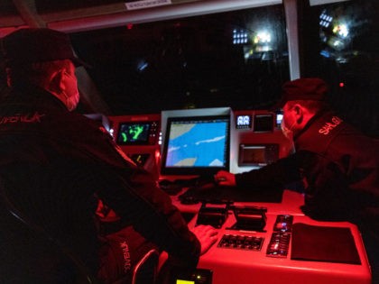 AVYALIK, TURKEY - OCTOBER 05: Members of the Turkish Coast Guard search for boats carrying refugees and migrants during a night patrol on the waters between Turkey and Greece on October 05, 2021 in Avyalik, Turkey. Since the U.S. pull-out from Afghanistan and the Taliban taking control of the country, …