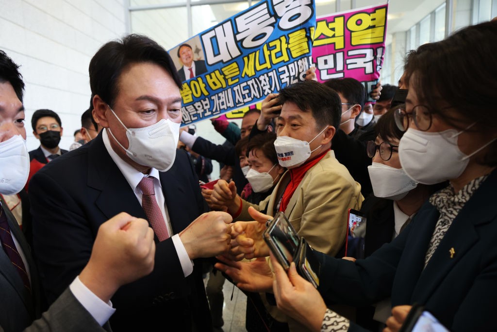 SEOUL, SOUTH KOREA - NOVEMBER 05: South Korea's People Power Party's contender for next year's presidential election candidate, Yoon Seok-Youl celebrates with his supporters after winning the final race to choose their presidential election candidate on November 5, 2021 in Seoul, South Korea. Yoon Seok-Youl won the main opposition People Power Party's nomination for president. The presidential election will be held on March 9 next year. (Photo by Kim Hong-Ji - Pool/Getty Images)