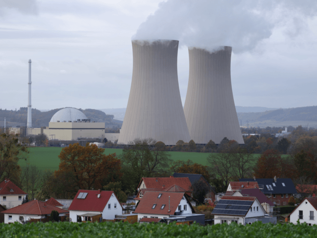 GROHNDE, GERMANY - NOVEMBER 08: Steam rises from cooling towers of the Grohnde Nuclear Power Plant near residential houses in the village of Latferde on November 08, 2021 near Grohnde, Germany. The 1360 megawatt plant, which is operated by PreussenElektra, is scheduled to shut down at the end of this …