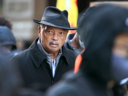 CHICAGO, ILLINOIS - NOVEMBER 20: Civil rights leader Rev. Jesse Jackson marches with activ