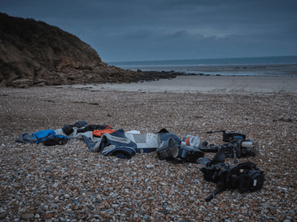 CALAIS, FRANCE - NOVEMBER 25: Belongings of migrants, along with a deflated dinghy, life jacket and engines, lie on the beach of Wimereux on November 25, 2021 in Calais, France. At least 31 people including five women and a young girl died trying to cross the Channel to the UK …