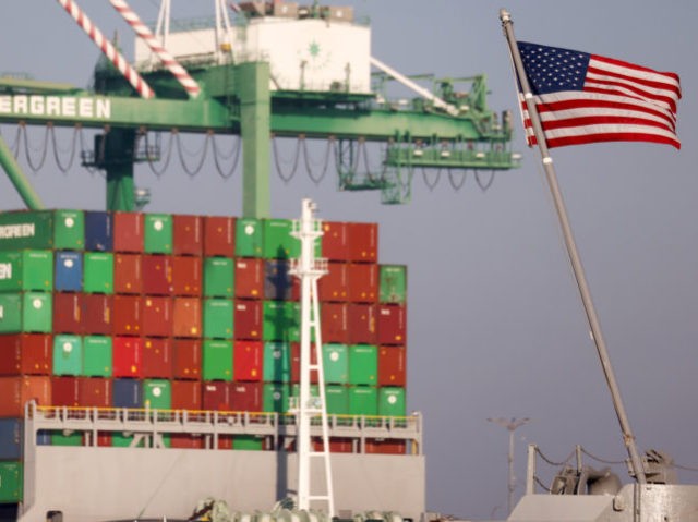 SAN PEDRO, CALIFORNIA - NOVEMBER 30: An American flag flies near a container ship at the Port of Los Angeles on November 30, 2021 in San Pedro, California. U.S. Secretary of Labor Marty Walsh toured the Port of Los Angeles with local officials today to discuss initiatives aimed to ease …