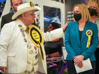 SHREWSBURY, UNITED KINGDOM - DECEMBER 17: Alan 'Howling Laud' Hope, Official Monster Raving Loony Party, congratulates North Shropshire by-election winner Helen Morgan of the Liberal Democrats, at Shrewsbury Sports Centre on December 17, 2021 in Shrewsbury, United Kingdom. The North Shropshire seat was previously held by Conservative MP Owen Paterson …