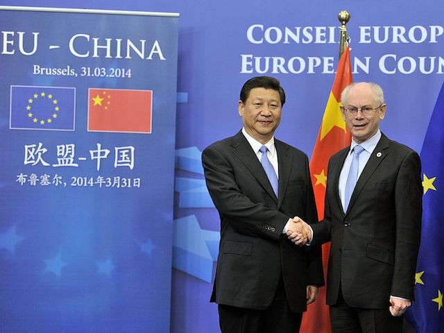 EU Council President Herman Van Rompuy (R) welcomes Chinese President Xi Jinping (L) on March 31, 2014 2013 for a working session at the EU Headquarters in Brussels. Xi Jinping began on March 30 a state visit to Belgium, punctuated by a historic visit to the EU, at the conclusion of his European tour marked by harvest commercial contracts. AFP PHOTO GEORGES GOBET (Photo credit should read GEORGES GOBET/AFP via Getty Images)