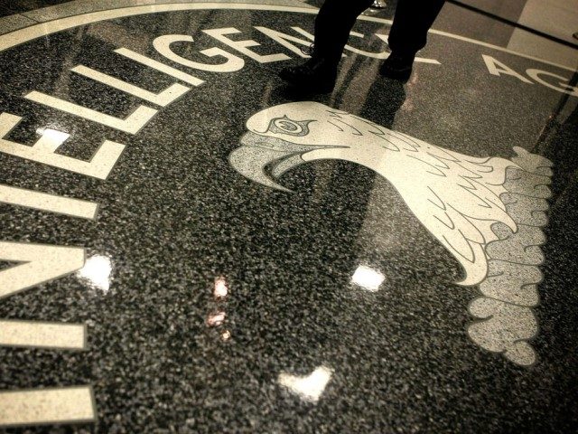 MCLEAN, VA - FEBRUARY 19: A man walks across the seal of the Central Intelligence Agency at the lobby of the Original Headquarters Building at the CIA headquarters February 19, 2009 in McLean, Virginia. (Photo by Alex Wong/Getty Images)