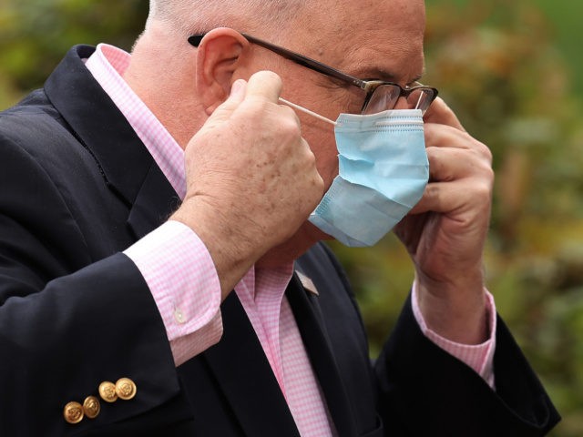 Maryland Governor Larry Hogan replaces his surgical mask after talking to reporters during a news briefing in front of the Maryland State House April 17, 2020 in Annapolis, Maryland. Maryland Superintendent of Schools Karen Salmon announced that all state public schools will remain closed until May 15. (Photo by Chip …