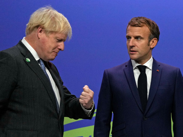 Britain's Prime Minister Boris Johnson greets French President Emmanuel Macron as he arrives to attend the COP26 UN Climate Change Conference in Glasgow, Scotland on November 1, 2021. - COP26, running from October 31 to November 12 in Glasgow will be the biggest climate conference since the 2015 Paris summit …