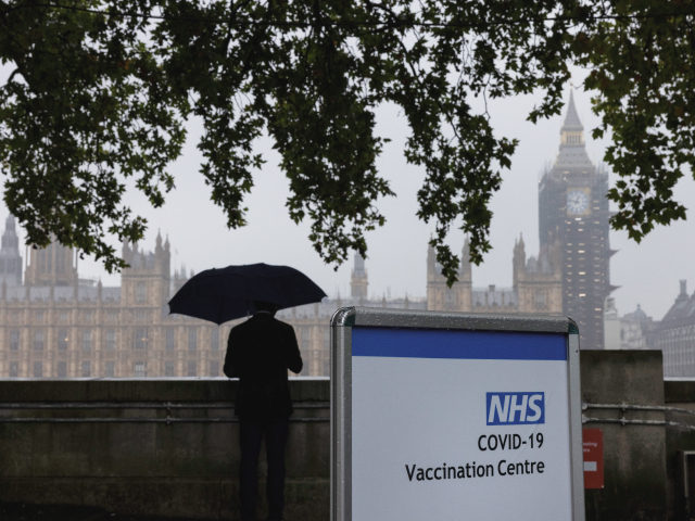 LONDON, UNITED KINGDOM - SEPTEMBER 13: A Covid-19 vaccination centre sign stands at St Thomas' hospital opposite Westminster on September 13, 2021 in London, United Kingdom. Tomorrow, British Prime Minister Boris Johnson will set out his plan to manage Covid-19 through the winter, including what actions would need to be …