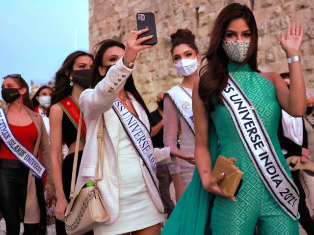 Contestants of the Miss Universe pageant take a selfie during a visit to the Tower of David Museum in the ancient citadel of Jerusalem near the Jaffa Gate entrance to Jerusalem's Old City, on November 30, 2021. (Photo by Menahem KAHANA / AFP) (Photo by MENAHEM KAHANA/AFP via Getty Images)