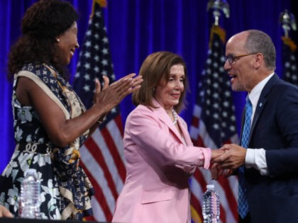 Speaker of the House Nancy Pelosi (C) (D-CA) is greeted by Democratic National Committee chairman Tom Perez (R) before speaking during the Democratic Presidential Committee (DNC) summer meeting on August 23, 2019 in San Francisco, California. Thirteen of the democratic presidential candidates are speaking at the DNC's summer meeting. (Photo …