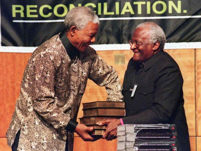 Nelson Mandela and Desmond Tutu (Walter Dhladhla / AFP / Getty)