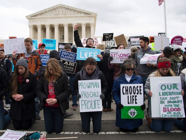 Pro-life activists gather in front of the US Supreme Court at the 44th annual March for Life on January 27, 2017 in Washington, DC. Anti-abortion activists are gathering for the 44th annual March for Life in Washington, protesting the 1973 Supreme Court decision legalizing abortion.