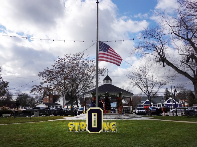 OXFORD, MICHIGAN - DECEMBER 02: A flag flies at half mast in Centennial Park in honor of the students and staff killed and wounded in the November 30 shooting at Oxford High School on December 2, 2021 in Oxford, Michigan. Four students were killed and seven others injured when student Ethan Crumbley allegedly opened fire with a pistol in the school.