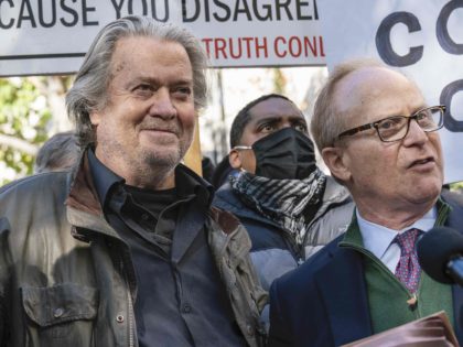 Former White House strategist Steve Bannon, center, and attorney David Schoen, right, pause to speak with reporters after departing federal court, Monday, Nov. 15, 2021, in Washington. (AP Photo/Alex Brandon)