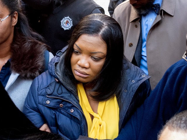 FILE — In this Nov. 25, 2019 file photo, Tova Noel, center in yellow blouse, a federal jail guard responsible for monitoring Jeffrey Epstein the night he killed himself, leaves federal court, in New York. Two Bureau of Prisons guards admitted falsifying records Tuesday, May 25, 2021, after Epstein's jail death in a deferred prosecution deal that will spare them a criminal record if they fully cooperate with investigators. (AP Photo/Craig Ruttle, File)