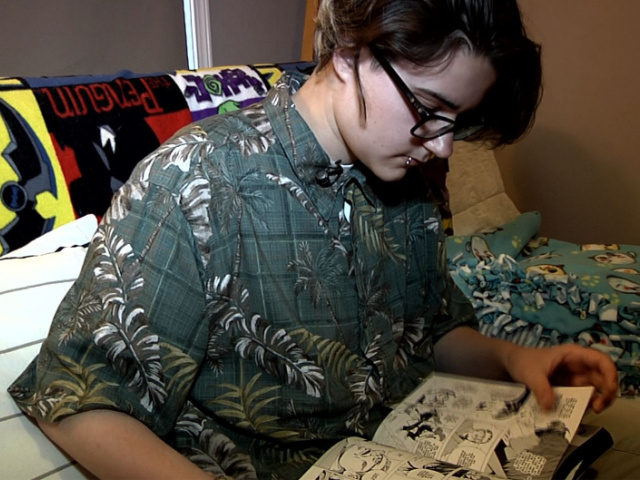 Arthur Brown, who is transgender -- born female but now identifying as male, reads a comic book at his house in Chicago, Illinois on on May 17, 2016. For transgender people, hodgepodge solutions to the lack of full access to public facilities are now giving way to discussions about basic …