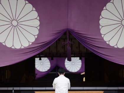 A man prays on the first day of autumn festival at Yasukuni Shrine in Tokyo on October 17, 2021. (Photo by Behrouz MEHRI / AFP) (Photo by BEHROUZ MEHRI/AFP via Getty Images)