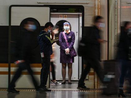 A staff member is seen on a train at the Hongqiao railway station in Shanghai, on October