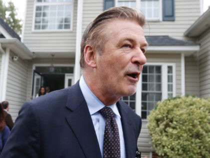 Actor Alec Baldwin, right ,walks with Amanda Pohl, candidate for Virginia Senate District