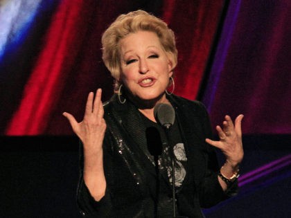 FILE - In this April 14, 2012 file photo, Bette Midler introduces the late Laura Nyro for induction into the Rock and Roll Hall of Fame in Cleveland. An online campaign to raise money so Native American tribes in South Dakota can purchase land they consider sacred has gained steam …
