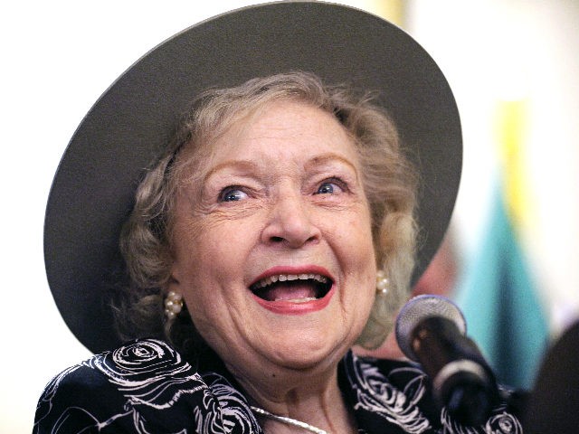 FILE - In this Nov. 9, 2010 file photo, actress Betty White wears a U.S. Forest Ranger hat