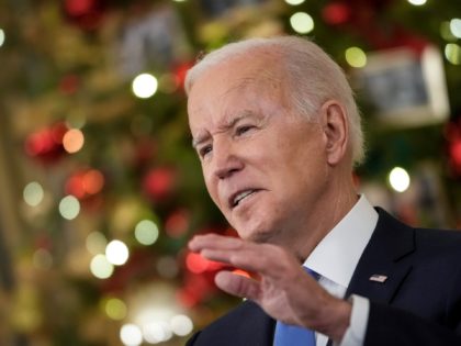 WASHINGTON, DC - DECEMBER 21: U.S. President Joe Biden speaks about the omicron variant of the coronavirus in the State Dining Room of the White House, December 21, 2021 in Washington, DC. As the omicron variant fuels a new wave of COVID-19 infections, Biden announced plans that will expand testing …