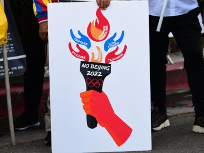 Activists rally in front of the Chinese Consulate in Los Angeles, California on November 3, 2021, calling for a boycott of the 2022 Beijing Winter Olympics due to concerns over China's human rights record. - Activists lobbied Olympic broadcasters, including NBC, BBC, CBC and Sky to "immediately cancel broadcasting deals" …