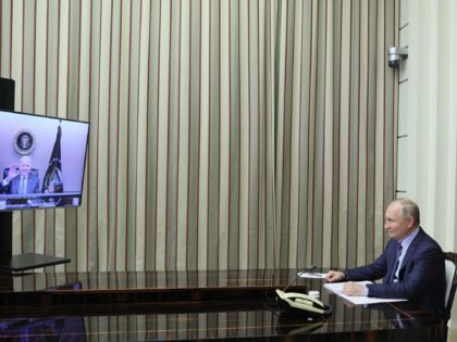 TOPSHOT - Russian President Vladimir Putin attends a meeting with US President Joe Biden via a video call in the Black Sea resort of Sochi on December 7, 2021. (Photo by Mikhail METZEL / SPUTNIK / AFP) (Photo by MIKHAIL METZEL/SPUTNIK/AFP via Getty Images)