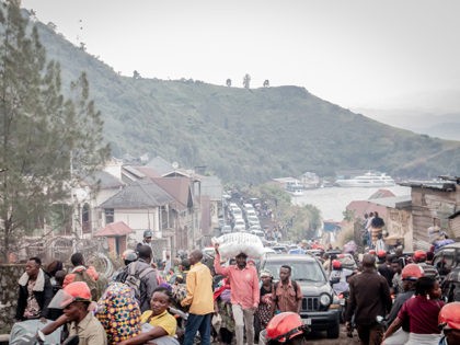 TOPSHOT - Goma residents are seen leaving after an evacuation order has been given on May 27, 2021. - The authorities in Goma, in the east of the Democratic Republic of Congo (DRC), on Thursday morning ordered the evacuation of part of the city because of the risk of eruption …