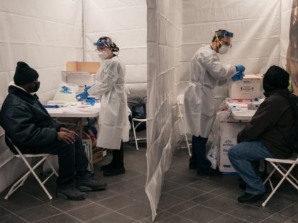 NEW YORK, NY - DECEMBER 27: Medical workers prepare COVID-19 tests at a new testing site inside the Times Square subway station on December 27, 2021 in New York City. After a week of record-breaking positive COVID test rates, New York City officials and agencies are working to ramp up …