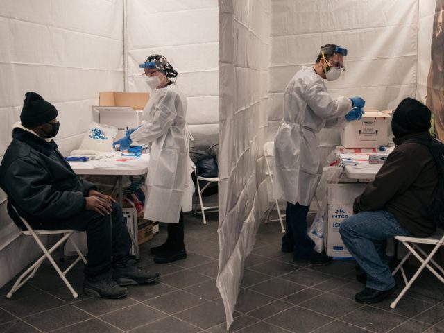 NEW YORK, NY - DECEMBER 27: Medical workers prepare COVID-19 tests at a new testing site i