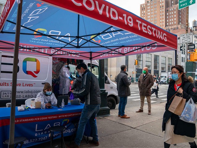 NEW YORK, NY - DECEMBER 15: A person registers to have a COVID-19 test administered at a walk up testing site on December 15, 2021 in New York City. The Centers for Disease Control and Prevention says the New York is one of two states with the highest spread of …