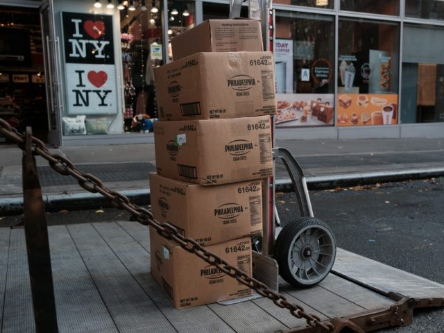 NEW YORK, NEW YORK - DECEMBER 06: Boxes of cream cheese are delivered to a store in Manhat