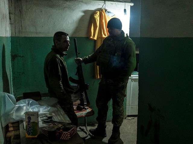 MARINKA, UKRAINE - DECEMBER 8: Ukrainian soldiers in a building on the front line on December 8, 2021 in Marinka, Ukraine. A build-up of Russian troops along the border with Ukraine has heightened worries that Russia intends to invade the Donbas region, most of which is held by separatists after …